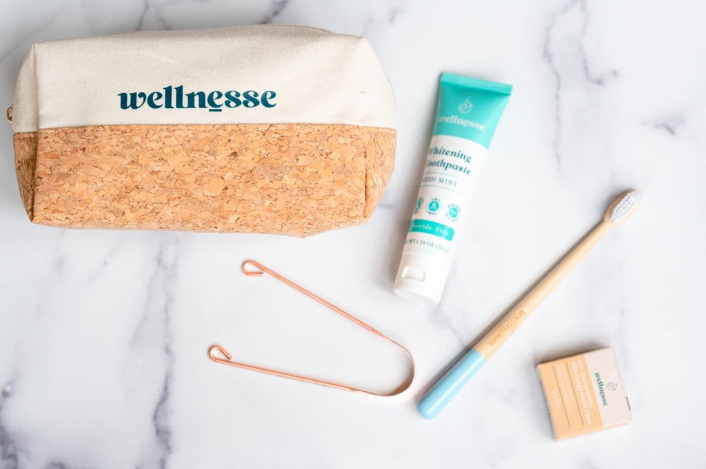 Wellnesse Essential Travel Oral Care Set - Compact Travel Dental Kit w/ 4 oz Whitening Hydroxyapatite Toothpaste, Adult Toothbrush, Copper Tongue Scraper, Silk Floss & Eco-Friendly Pouch, Mint Flavor