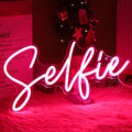 SYLHOME Selfie Pink LED Neon Light Sign Cute Makeup Girls Bedroom Light Up Mirror Wall Decor Sign Photo Studio Boys Kids Room Birthday Party Decor USB 15.2" X 7.1"