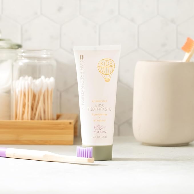 CariFree Naturals Kids Toothpaste | Fluoride-Free, 40% Xylitol, Organic Wild Berry Flavor, pH Elevated, Safe if Swallowed, Sugar-Free, 2.4 oz, Dentist Developed