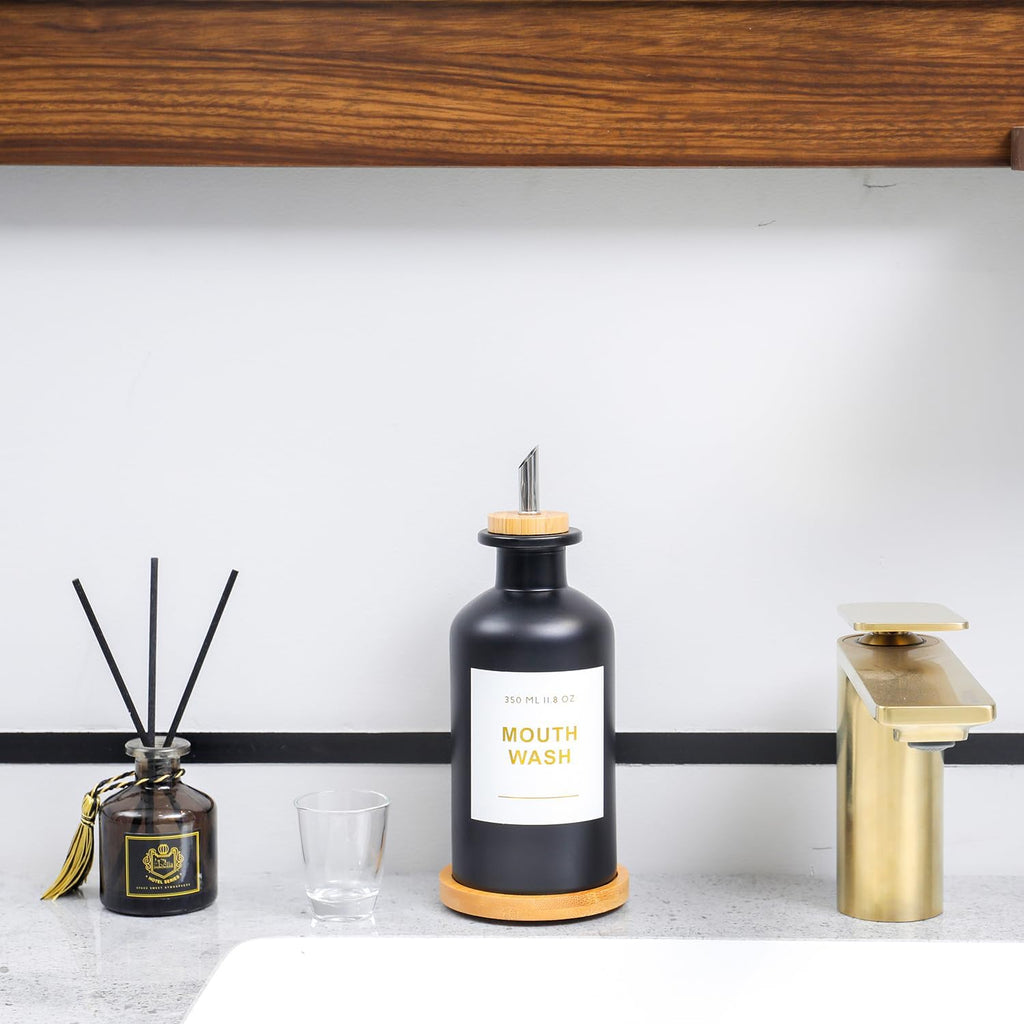 11.8OZ Glass Mouthwash Dispenser for Bathroom with Stainless Steel & Bamboo Nozzle, Mouthwash Cup Reusable, Bamboo Tray, and Elegant Gold Sticker.(Black)