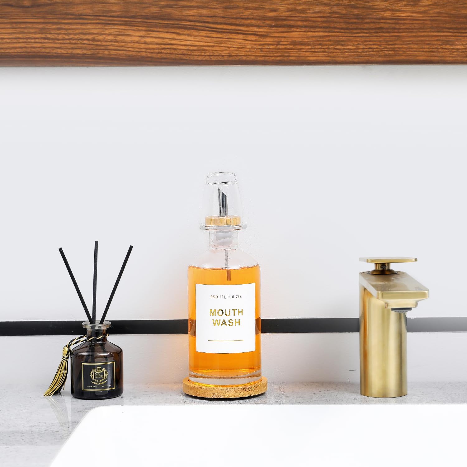 11.8OZ Glass Mouthwash Dispenser for Bathroom with Stainless Steel & Bamboo Nozzle, Mouthwash Cup Reusable, Bamboo Tray, and Elegant Gold Sticker.（Clear