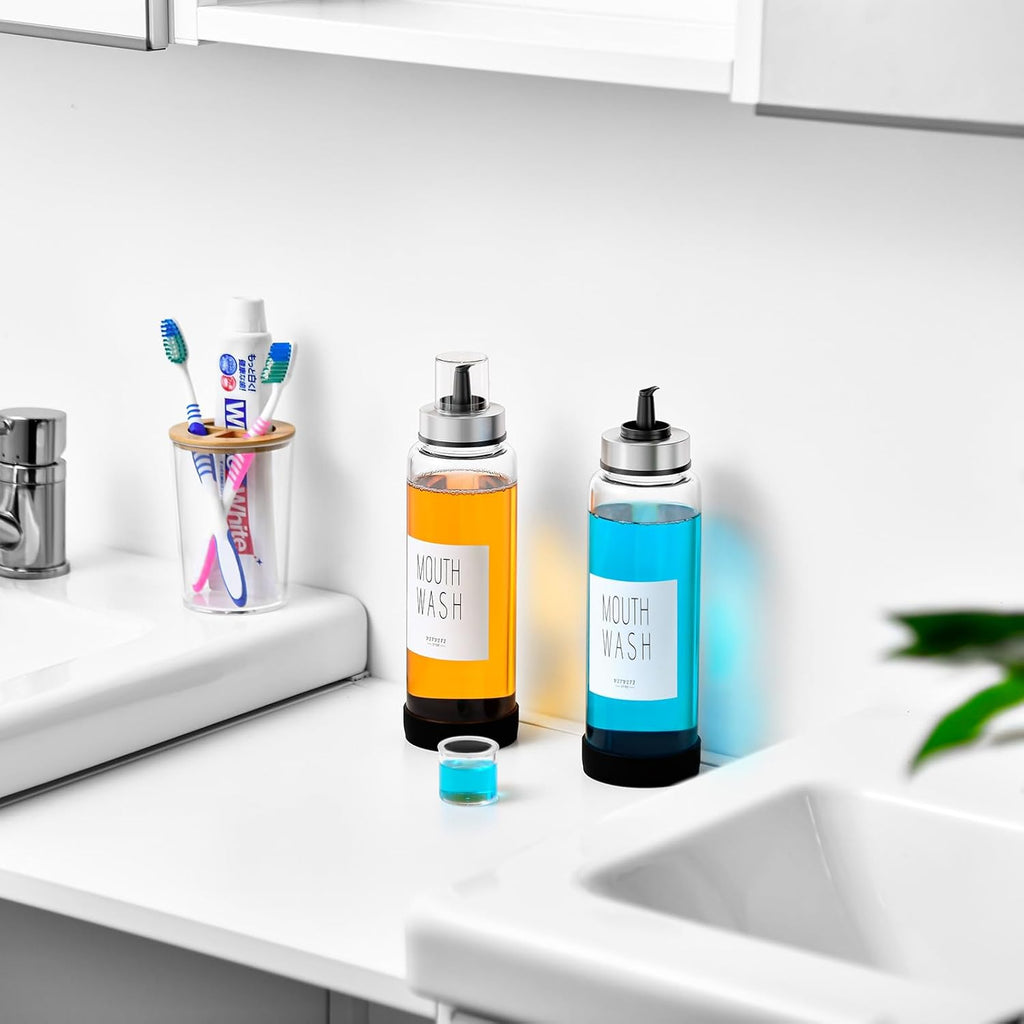 VITVITI Mouthwash Dispenser for Bathroom, Glass Mouth Wash Container with Cup Lid, 17OZ Clear Refillable Mouthwash Bottle Decanter with Silicone Pad/Labels, Set of 2