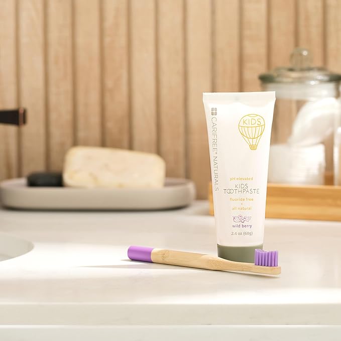 CariFree Naturals Kids Toothpaste | Fluoride-Free, 40% Xylitol, Organic Wild Berry Flavor, pH Elevated, Safe if Swallowed, Sugar-Free, 2.4 oz, Dentist Developed