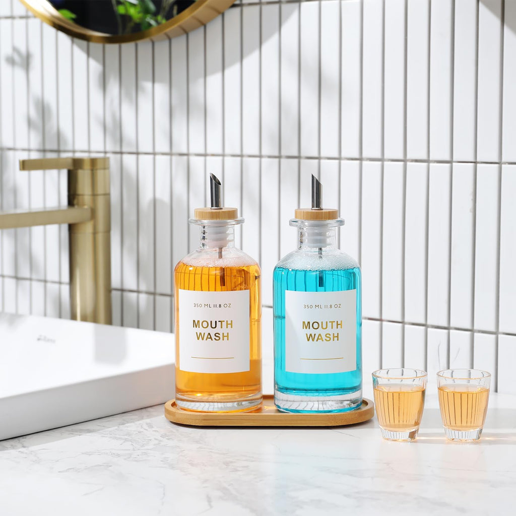 11.8OZ Glass Mouthwash Dispenser for Bathroom with Stainless Steel & Bamboo Nozzle, Mouthwash Cup Reusable, Bamboo Tray, and Elegant Gold Sticker.Set of 2（Clear