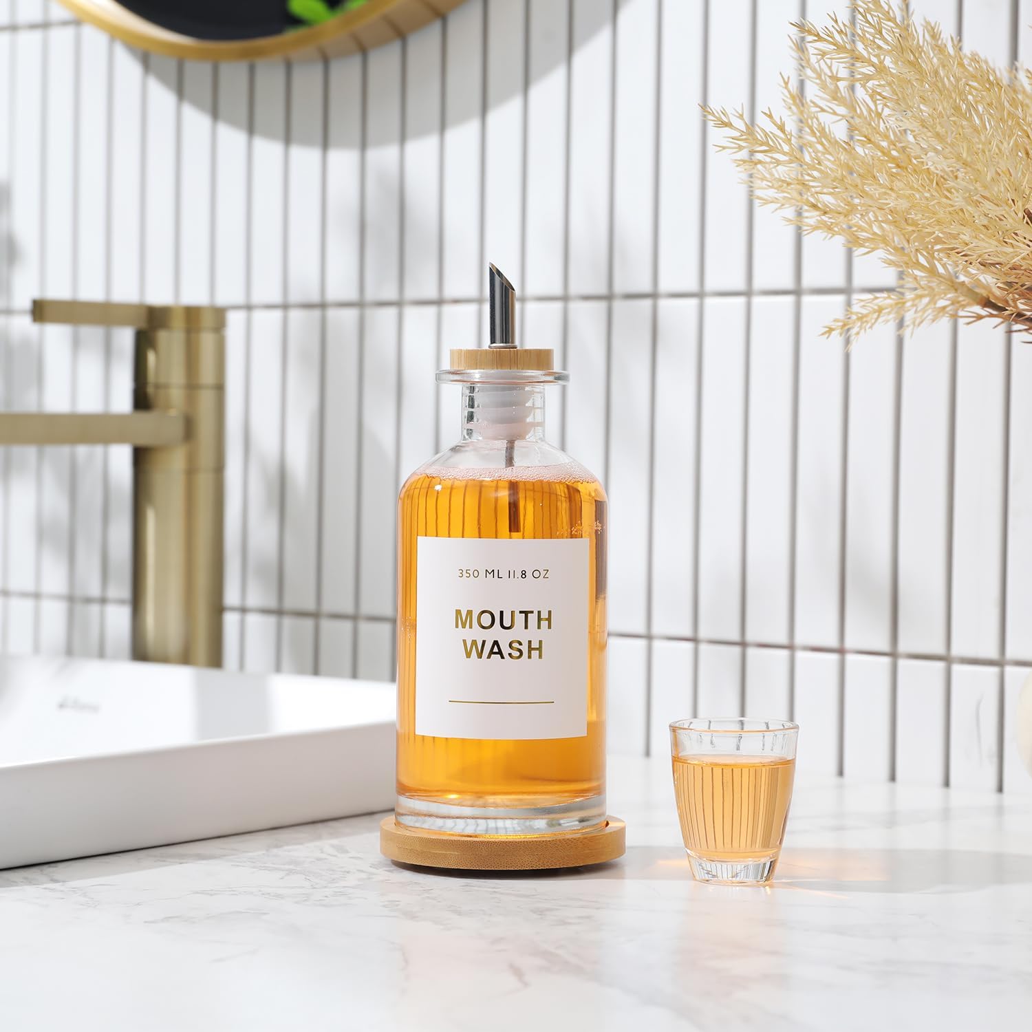 11.8OZ Glass Mouthwash Dispenser for Bathroom with Stainless Steel & Bamboo Nozzle, Mouthwash Cup Reusable, Bamboo Tray, and Elegant Gold Sticker.（Clear